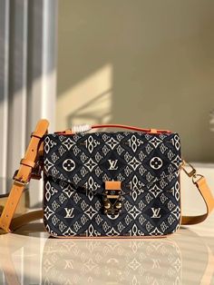 The fashionable Pochette Métis is made from jacquard Since 1854 textile for Winter 2020. The vintage-inspired woven pattern combines Louis Vuitton symbols with the number 1854, the year the company began business. This go-everywhere bag boasts a chic top handle and a long detachable strap for shoulder or cross-body wear. Detailed Features 25 x 19 x 7 cm / 9.8 x 7.5 x 2.8 inches (Length x height x width ) Blue Jacquard Since 1854 textile Natural cowhide leather trim Microfibre lining Gold-colour hardware S-lock closure Outside zipped pocket 3 inside compartments Strap: Removable, adjustable Strap Drop: 48.0 cm/18.9 inches Strap Drop Max: 55.0 cm/21.7 inches Handle: Single Woven Pattern, Chic Top, Vanuatu, Vuitton Bag, Sierra Leone, Brunei, Cowhide Leather, Bottega Veneta, Leather Trims