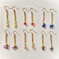 Lil Fruit Earrings Length: 1.25 - 1.5 inches Made with 18k gold plated hooks and glass beads. 14k Gold-filled Beaded Drop Earrings, Dangle Beaded Earrings With 14k Gold Filled, 14k Gold-filled Dangle Beaded Earrings With Gold Beads, 14k Gold Filled Dangle Beaded Earrings With Gold Beads, 14k Gold-filled Beaded Dangle Earrings, Gold Czech Glass Dangle Flower Earrings, Gold Dangle Flower Earrings With Czech Glass, Gold Flower Earrings With Dangling Beads As Gift, Dainty Beaded Earrings With Round Beads