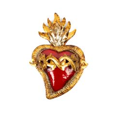 a heart shaped brooch with gold and red glass in the shape of a crown