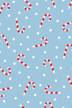 candy canes and snowflakes on a blue background with white polka dotes