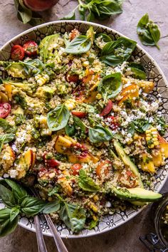 a bowl filled with rice and vegetables on top of a table