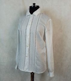 Vintage romantic blouse, button up, lace trim, long sleeve, 100% cotton. In very good clean condition. Flat measurements: shoulders - 37 cm/ 14.5'' chest/pit to pit/ - 49 cm/ 19.2'' sveeve/from shoulder/ - 64 cm/ 25.2'' lenght - 65 cm/ 25.5'' The measurements correspond to the size M Classic Fitted Blouse With Broderie Anglaise, Elegant Cotton Shirt With Lace Collar, Fitted Cotton Shirt With Lace Collar, Classic Long Sleeve Shirt With Lace Trim, Elegant Long Sleeve Shirt With Broderie Anglaise, Classic Button-up Shirt With Lace Trim, Fitted Cotton Shirt With Lace Trim, Classic Summer Shirt With Lace Trim, Classic White Shirt With Lace Trim