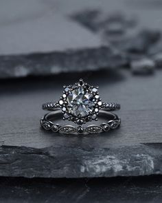 a white gold engagement ring with an intricate flower design