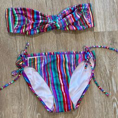 Striped Bandeau Bikini Set Brand: Victoria’s Secret Size: Small Color: Multi-Stripe Flattering Bandeau Top (Not Lined) String Bikini Bottom With Ties At Hips Excellent Condition!! Never Worn!! No Stains Or Signs Of Wear From A Smoke & Pet-Free Home Multicolor Bandeau Swimwear For Pool, Multicolor Bandeau Swimwear For Beach, Multicolor Bandeau Swimwear For Beach Season, Multicolor Strapless Tankini For Vacation, Beachwear Multicolor Bandeau Swimwear, Multicolor Strapless Swimwear For Poolside, Multicolor Strapless Swimwear For Beach Season, Multicolor Bandeau Tankini For Pool, Multicolor Bandeau Swimwear For Spring