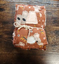 a small piece of fabric with sheeps on it