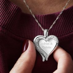 Our Silver Brushed Heart Swing Necklace makes a perfect gift for anniversaries, birthdays, graduation, and many other celebrations. Engrave the heart charm with their name, initials, a special date, or a short message.  𝘼𝙗𝙤𝙪𝙩 𝙩𝙝𝙚 𝙄𝙩𝙚𝙢:  - Silver plated swing necklace with pave heart outline and heart charm  - Measures 16" long with 2" extender chain  - Pendant measures approximately 0.8"H  - Comes in velvet pouch  - Clean with soft cloth Silver Heart Necklace For Birthday Gift, Silver Heart Necklace With Name For Birthday Gift, White Heart Necklace With Charm For Birthday, Silver Engraved Heart Necklace For Birthday, Silver Engraved Heart Necklace As Birthday Gift, Hallmark Heart Pendant Jewelry For Birthday, Open Heart Name Jewelry As Gift, Open Heart Name Jewelry As A Gift, Personalized Heart Necklaces For Anniversary