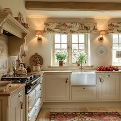 a kitchen filled with lots of white cabinets and counter top space next to a window