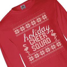 Congratulations, you've made the squad! The Holiday Cheer Squad, that is! You'll look cheery all holiday season sporting this long sleeve Christmas t-shirt. Featuring a festive Christmas sweater pattern and flamingos, the red graphic tee is the perfect look for a day of Christmas shopping, decorating the tree or even a casual holiday party! © OTC

o Fits sizes 34-36
o Brand: Fruit of the Loom
o Long sleeve
o High-density fabric
o 100% pre-shrunk cotton, 5.0 oz.
o Tear away label
o Doub Casual Holiday Party, Sport Shirt Design, Cheer Squad, All Holidays, Christmas Tshirts, Sports Shirts, Sweater Pattern, Christmas Shopping, Holiday Cheer