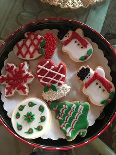 some decorated cookies in a bowl on a table