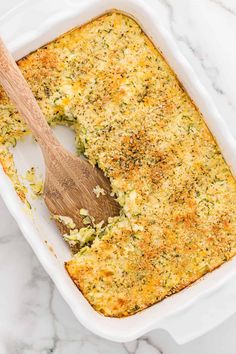 a casserole dish filled with broccoli and cheese