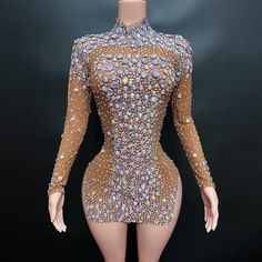 a mannequin is dressed in a bodysuit with sequins and beads