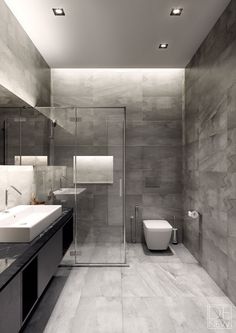 a modern bathroom with two sinks and a toilet