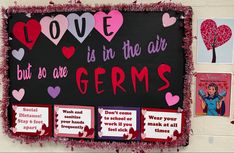 valentine's day bulletin board with love is in the air and germs