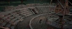 an aerial view of a construction site with large rocks on the ground and people walking around it