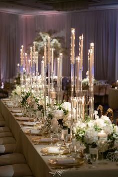 a long table is set with candles and flowers for an elegant wedding reception at the four seasons hotel