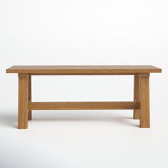 a wooden bench sitting on top of a white floor