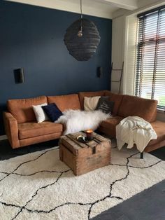 a living room filled with furniture and decor