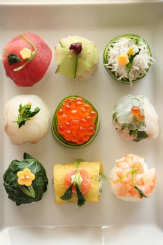 there are many different sushi on the plate