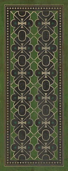 a green rug with black and white designs on it