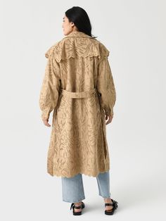 DESCRIPTION:An embroidered laise cotton trench coat made featuring a feminine silhouette with puff sleeves and scalloped trims.FEATURES:Spread CollarShoulder OverlayPuff SleevesSide PocketsButton-Down FrontSelf-Tie BeltScalloped TrimsEmbroidered Laise DesignLong Silhouette100% CottonRelaxed FitModel is wearing size Small coat.Model's Measurements: Height: 5'8" | Bust: 32B | Waist: 25" | Hips: 36.5" | Dress Size: 2 (US) Embroidered Fall Outerwear For Daywear, Embroidered Outerwear For Fall Daywear, Embroidered Outerwear For Daywear In Fall, Fall Ruffled Outerwear For Daywear, Fall Daywear Outerwear With Ruffles, Farm Rio Coat, Sezane Farm Rio, Cotton Trench Coat, Feminine Silhouette