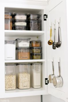 an organized pantry with lots of containers and utensils