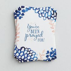 a greeting card with blue flowers and the words you've been prayed for