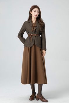 About this item: This long brown wool dress has bow and button decoration. The attention to detail in the construction of this women brown long wool dress is evident in every stitch,  show casing the craftsmanship and expertise that went into its creation.  This made-to-measure brown wool dress，crafted with an eye for detail and a commitment to excellence. DETAIL * 30% wool, 30% fiber, 40% polyester * Fully satiny lining, more nice to the touch body * Two side seam pockets      * Back zipper closure        * Long wool dress * Fit and flare dress * V neckline  * Long sleeves * Brown wool dress * Formal dress * Perfect for autumn and winter * Dry clean * Belt not for sale * Learn More about the items From the FAQs on the page bottom MODEL SIZE Bust 85 cm(33.4") Waist 67 cm(26.7") Height 168c Flare Dress Formal, Fit And Flare Dress Formal, Long Wool Dress, Button Decorations, Custom Dress, Dress Autumn, Autumn Dress, Dress Crafts, Dress Formal