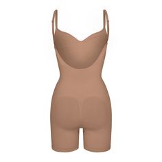 A sculpting bodysuit that sculpts silhouette, cinches waist, and smooth thighs while providing support and lift for your curves. Featuring a deep scoop back that makes it the perfect backless shapewear option. | SKIMS Low Back Mid Thigh Bodysuit | Medium Neutral | Seamless Sculpt Backless Shapewear, Sculpting Bodysuit, Fall Shopping, Cinched Waist, Low Back, Shapewear, Lounge Wear