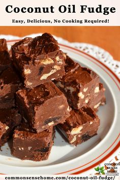 a plate full of chocolate fudge brownies on a table with the words coconut oil fudge