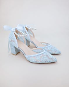 "Crochet Lace Wedding Shoes Collection. Classic and refined almond toe crochet lace with added pearls strap details. Choose from pearl/gold, pearl/silver, or all pearls ankle straps to match with your bridal look. The luminous pearls makes this a classy and elegant shoes for wedding, evening wear, or romantic date. DETAILS: HEEL HEIGHT: 2.75 inches COLORS AVAILABLE: Ivory, White and Light Blue UPPER: Synthetic upper and lining MATERIALS: Manmade outsole STYLE NAME: ABBY  SIZE FIT: RUNS LARGE  No Summer Lace Wedding Shoes With Low Heel, Lace Wedding Shoes For Bridesmaids, Spring Wedding Shoes With Lace And Ankle Strap, Spring Wedding Shoes With Ankle Strap In Lace, Spring Lace Wedding Shoes With Ankle Strap, Spring Wedding Shoes With Lace For Ceremony, Spring Wedding Shoes In Lace For Ceremony, Spring Wedding Lace Shoes For Ceremony, Spring Wedding Lace Shoes