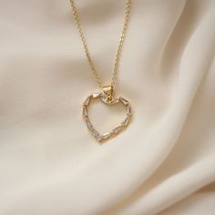 Beautiful dainty heart necklace made with cubic zirconia stones. A romantic necklace that makes a perfect gift for someone you love or yourself.  Gold Filled Necklace Gift Heart Necklace With Adjustable Chain And Cubic Zirconia, Dainty Heart Pendant Necklace In Cubic Zirconia, Dainty Cubic Zirconia Heart Pendant Necklace, Heart-shaped Cubic Zirconia Necklace For Her, Dainty Cubic Zirconia Heart Necklace For Anniversary, Heart-shaped Cubic Zirconia Necklace Gift For Her, Minimalist Cubic Zirconia Necklaces For Valentine's Day, Heart Pendant Diamond Necklace With Adjustable Chain, Dainty Heart-shaped Cubic Zirconia Charm Necklace