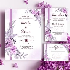 wedding stationery with purple flowers and greenery on the front, in watercolor