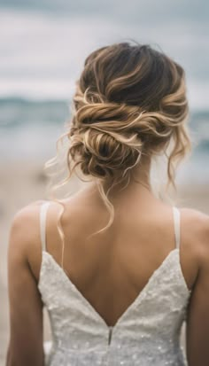 the back of a woman's head wearing a wedding dress