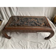 This table was owned by the Cessna family, used in their game room. A Chinese rectangular cocktail or opium table with a glass top and deeply carved reliefs depicting a fighting scene. The table's uniqueness is furthered with the addition of curved chow legs. It is a very sturdily constructed table. Has a hidden drawer, opened with a button located underneath the top. Whimsigoth Coffee Table, Asian Coffee Table, Chinese Tea Table, Ethnic Furniture, Chinese Table, Hidden Drawer, Bohemian House, Chinese Tea, Furniture Pieces