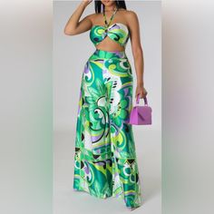 Accra Nights 2 Piece Pants Set. Make A Statement In This Gorgeous Outfit. Details: Two Piece Set Crop Top Halter Sleeveless Satin Self Tie Closure Zipper Closure High Waisted Pants Non-Stretch Satin Wide Legs Side Zipper Closure 100% Polyester Hand Wash Cold