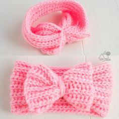 there is a crocheted pink bow on the headband and it has a knot at the end