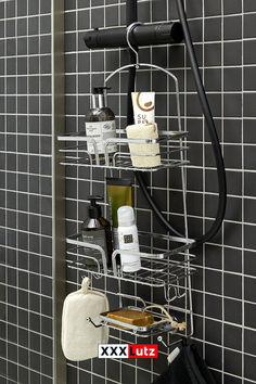 a bathroom shower caddy with soap, lotion and other personal care items on it