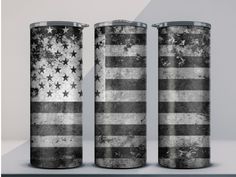 three metal canisters with the american flag painted on them, sitting side by side