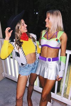 two women dressed in costumes standing next to each other