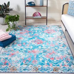 a blue and pink rug in a living room