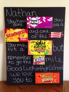 a chalk board with candy bars on it