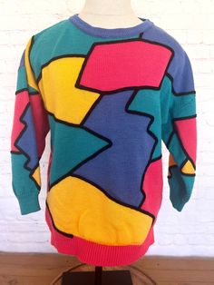 "90's Chaus vibrant colored pullover sweater Colors in bright coral, teal, periwinkle blue, yellow and outlined in black. 3/4 sleeves 100% Acrylic Size Small Excellent condition Free shipping!! Measurements when laying flat across: Bust - 20\" Sleeve - 13\" Length - 25\"" Colorful Color Block Crew Neck Sweater, 90s Style Green Long Sleeve Sweater, 90s Fitted Crew Neck Sweater, Fitted 90s Crew Neck Sweater, Fitted Crew Neck Sweater 90s Style, 90s Style Long Sleeve Spring Sweater, Fitted Long Sleeve 90s Sweater, Oversized Multicolor Retro Sweater, 90s Style Multicolor Long Sleeve Sweatshirt