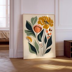 a painting on the wall in a room with wood flooring and white walls,