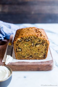 a loaf of banana nut bread on a cutting board