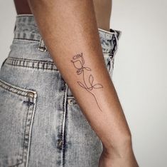 a person with a flower tattoo on their arm