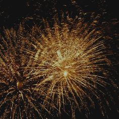 fireworks are lit up in the night sky