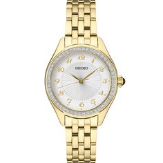 This women's timepiece has a quartz movement and has a round 29MM case. The case and bracelet have a yellow gold-tone and the dial is silver. The bezel is set with Swarovski crystals. Elegant Yellow Gold Chronograph Watch, Formal Yellow Gold Diamond Watch With Chronograph, Formal Yellow Gold Diamond Chronograph Watch, Elegant Yellow Gold Watches With Round Dial, Yellow Gold Analog Watch For Anniversary, Anniversary Yellow Gold Analog Watch, Elegant Diamond Watch With Polished Finish And Round Dial, Yellow Gold Watch With Round Dial For Evening, Elegant Chronograph Jewelry And Watches For Anniversary