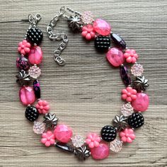 💞One of a kind & ready to ship💞  Dress up any outfit - great for a night out or with a white tee! 16 Inch Necklace with a 4 inch silver extender chain and silver lobster clasp. This is an eclectic bunch of acrylic beads in pink and black. A total conversion starter!  Thank you for supporting American small business! *Smoke and pet free home!* I ship 6 days a week! This particular necklace one of a kind and is READY TO SHIP!  Thank you for browsing my store! Adjustable Pink Beaded Necklace With Black Beads, Black And Pink Beaded Necklace, Playful Pink Jewelry With Large Beads, Green And Pink Necklace, Pink Multi-strand Jewelry With Polished Beads, Acrylic Jewelry, 16 Inch Necklace, Necklace Chunky, Jewelry Black