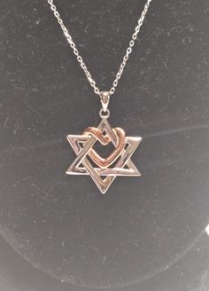 Silver and rose gold star of David with heart necklace Width: 26mm Height: 18.6mm Chain length: 45cm Valentine's Day Silver Jewelry With Star Charm, Silver Heart Necklace With Star Charm, Rose Gold Star Charm Jewelry For Anniversary, Elegant Star Of David Necklace With Delicate Chain, Rose Gold Star Necklace In Sterling Silver, Rose Gold Sterling Silver Star Necklace, Elegant Star Of David Necklace, Silver Star Of David Necklace With Gemstone, Silver Star Of David Necklace