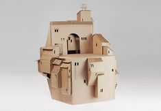 a cardboard model of a castle made to look like it is floating in the air